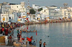 pilgrims taking dips in the holy pushkar sarovar, holy lake, it's said that one can atone for (or, cleanse) their sins by taking dips in the holy lake.