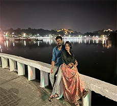 guests of namaste holiday visiting udiapur with lake city as background, having nice picturesque moments.